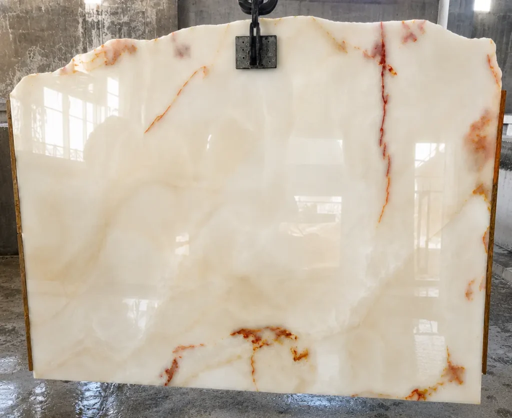 Premium grade Afghan White Onyx slab stacked in warehouse before shipping to international clients