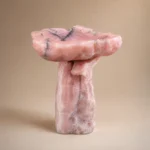Custom pink onyx bathroom vanity with sculptural pedestal design