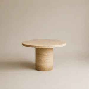 Handcrafted natural travertine tables featuring round polished tops and cylindrical bases, custom-made by Pakistan Marble & Onyx for luxury interiors
