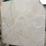 Large format Afghan White Onyx slab showing natural translucency and light passing through the stone