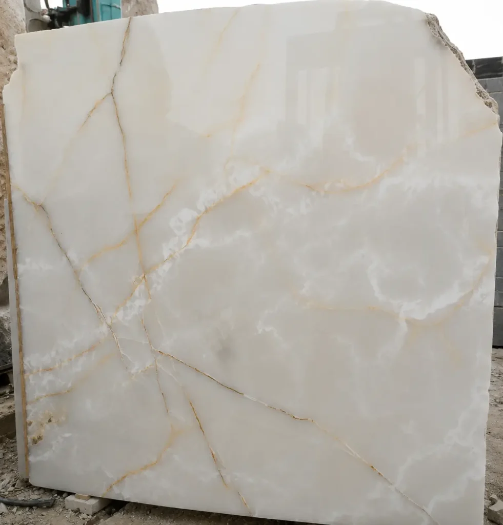 Large format Afghan White Onyx slab showing natural translucency and light passing through the stone