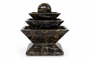 Black & Gold Marble Fountain handcrafted by Pakistan Marble & Onyx featuring a modern three-tier geometric design with a polished marble sphere for luxury gardens, villas, hotels, commercial landscapes, and worldwide export.
