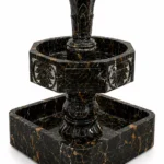 Handcrafted Black, Gold & White Marble Heritage Fountain by Pakistan Marble & Onyx featuring a geometric basin and elegant carved details for luxury homes, villas, hotels, resorts, courtyards, gardens, commercial landscapes, and premium outdoor water features.