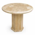 Natural Travertine marble round dining table with a minimalist pedestal base, handcrafted for luxury residential and commercial interiors.