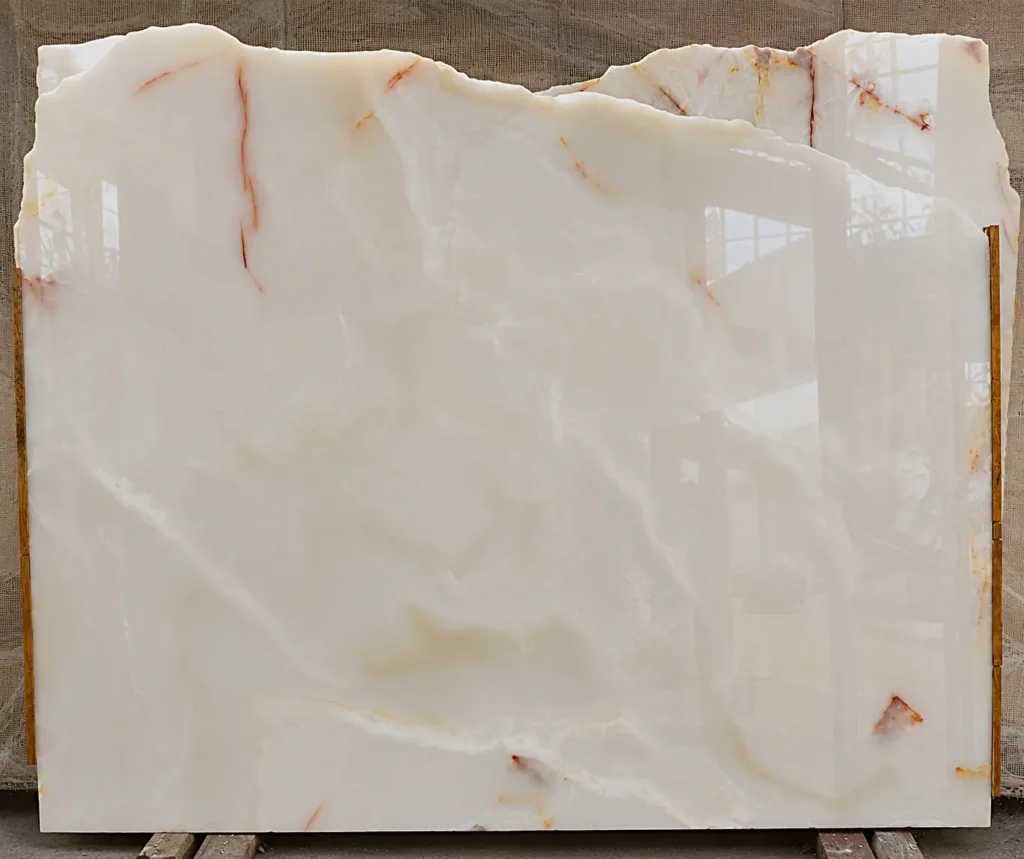 Afghan White Onyx slab with soft golden veining and high polish finish exported by Pakistan Marble and Onyx