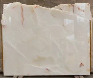Afghan White Onyx slab with soft golden veining and high polish finish exported by Pakistan Marble and Onyx