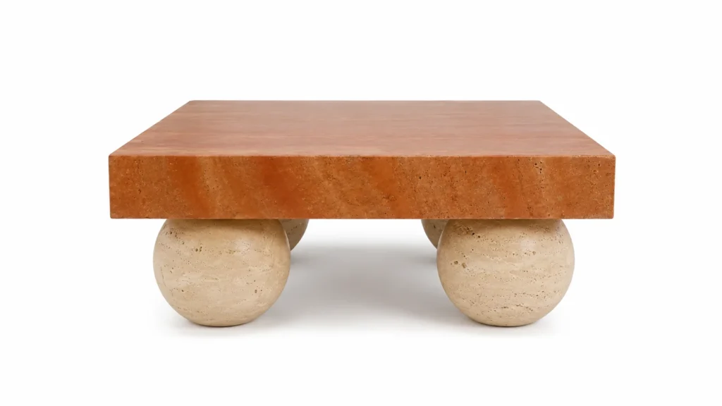Red Travertine coffee table with a rectangular top and sculptural Beige Travertine sphere bases, handcrafted by Pakistan Marble & Onyx.