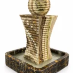 Modern Travertine Onyx Waterfall Fountain handcrafted by Pakistan Marble & Onyx with a Black & Gold Marble base, ribbed stone sphere, and cascading water feature for luxury gardens, hotels, villas, and worldwide export.
